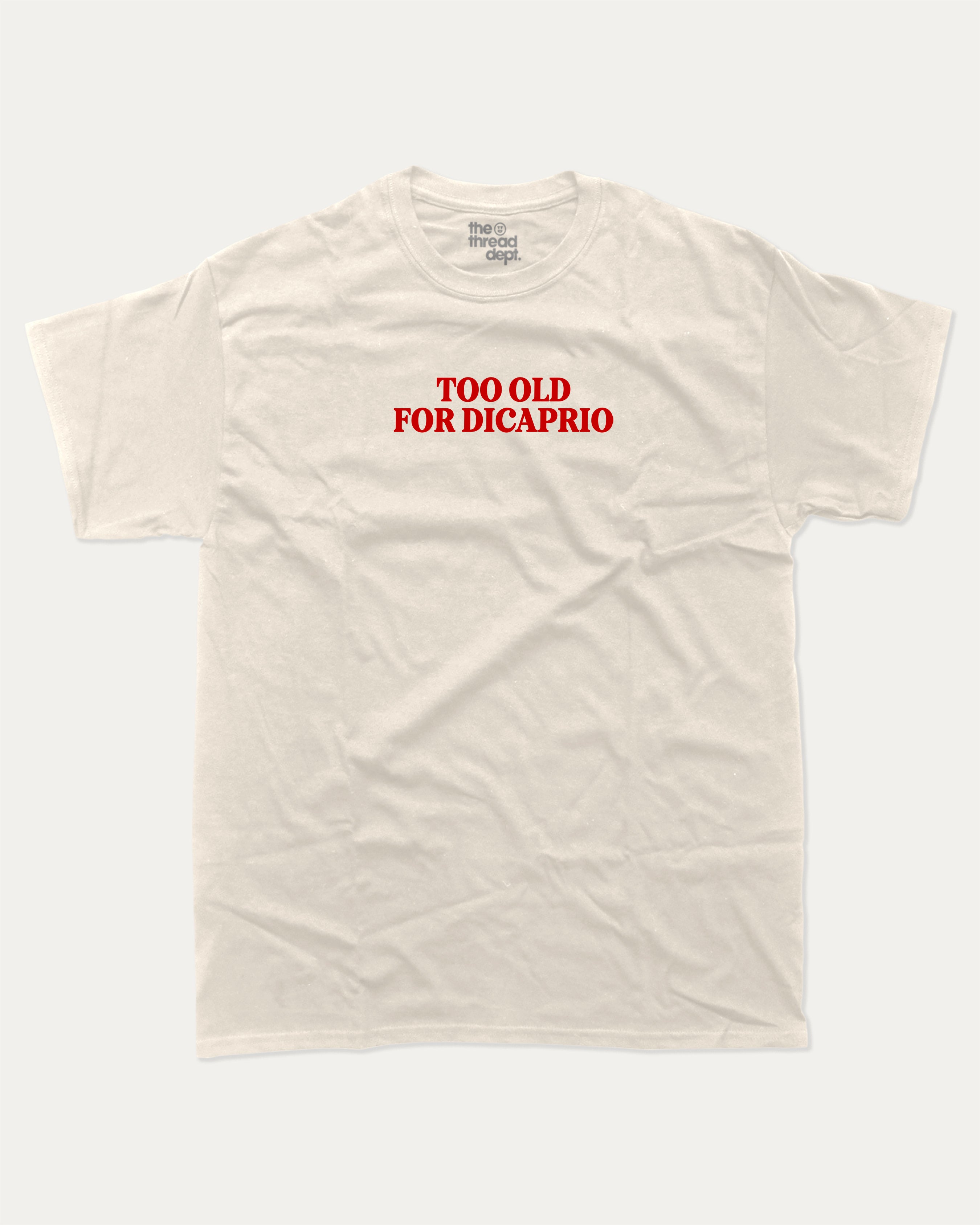 Too Old For Dicaprio graphic tee with bold and humorous print, funny and trendy graphic. Perfect for adults and gift-giving. Cream shirt.