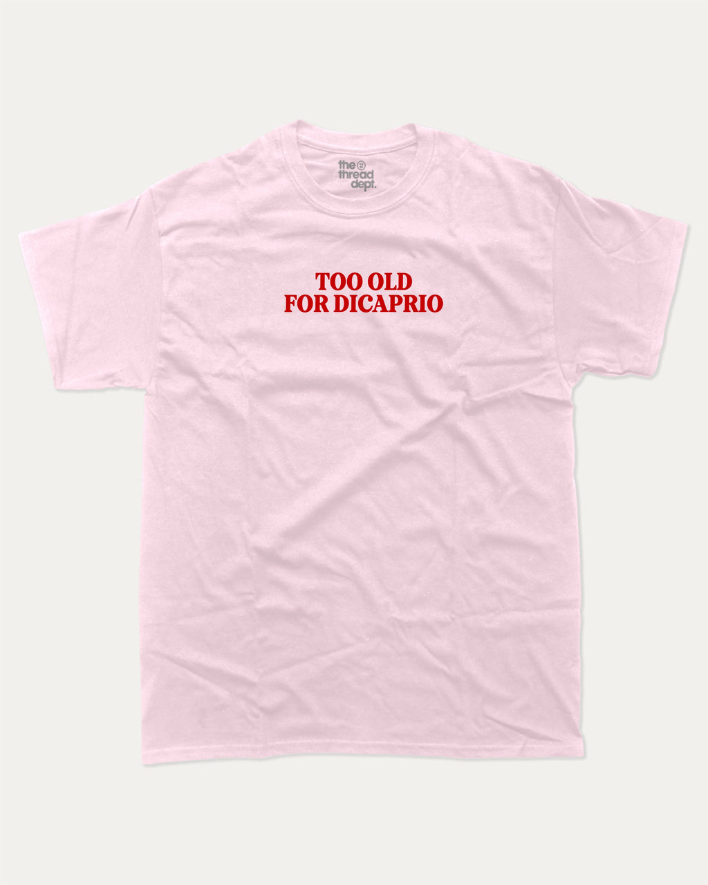 Too Old For Dicaprio graphic tee with bold and humorous print, funny and trendy graphic. Perfect for adults and gift-giving. Pink shirt.