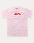 Too Old For Dicaprio graphic tee with bold and humorous print, funny and trendy graphic. Perfect for adults and gift-giving. Pink shirt.