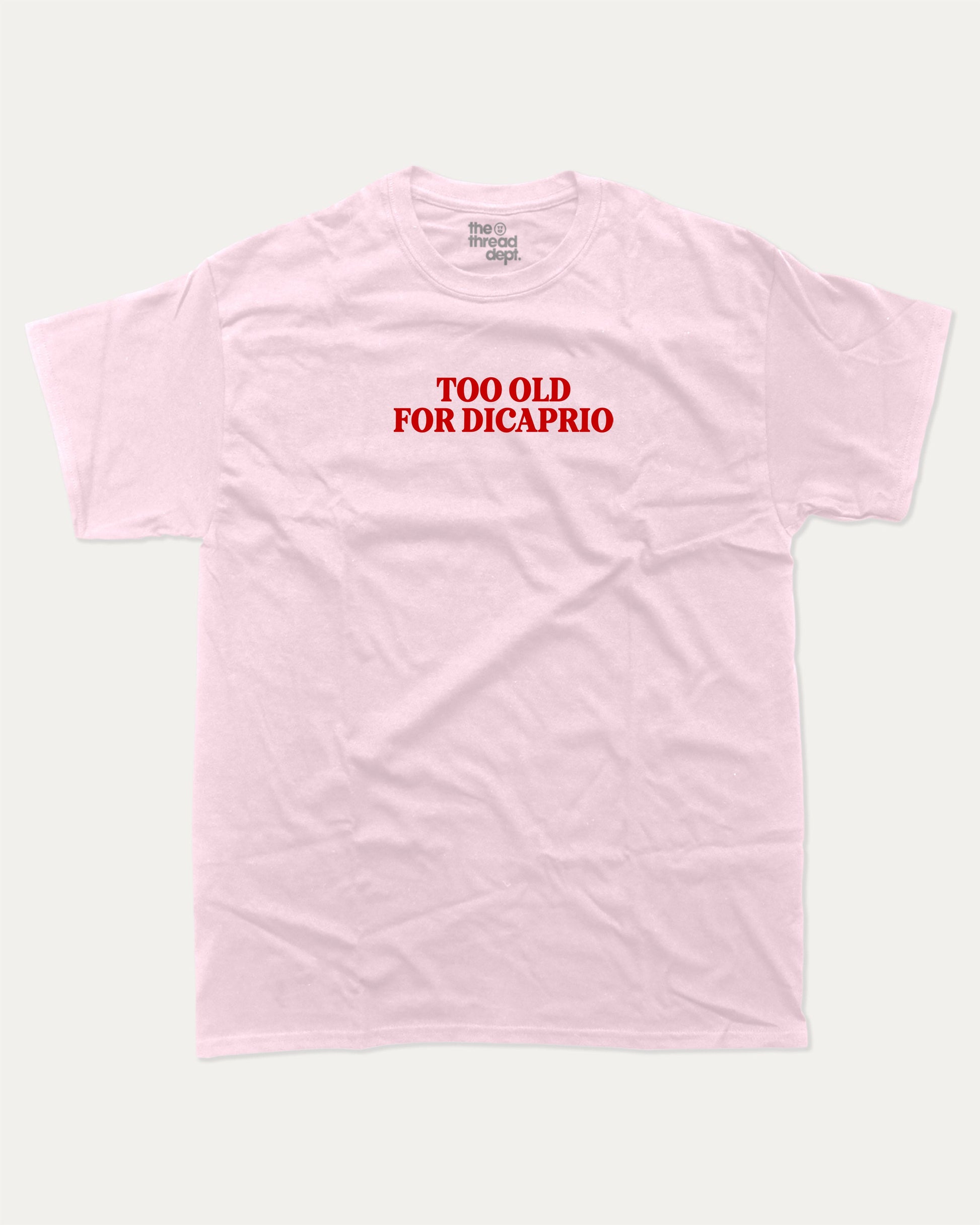 Too Old For Dicaprio graphic tee with bold and humorous print, funny and trendy graphic. Perfect for adults and gift-giving. Pink shirt.