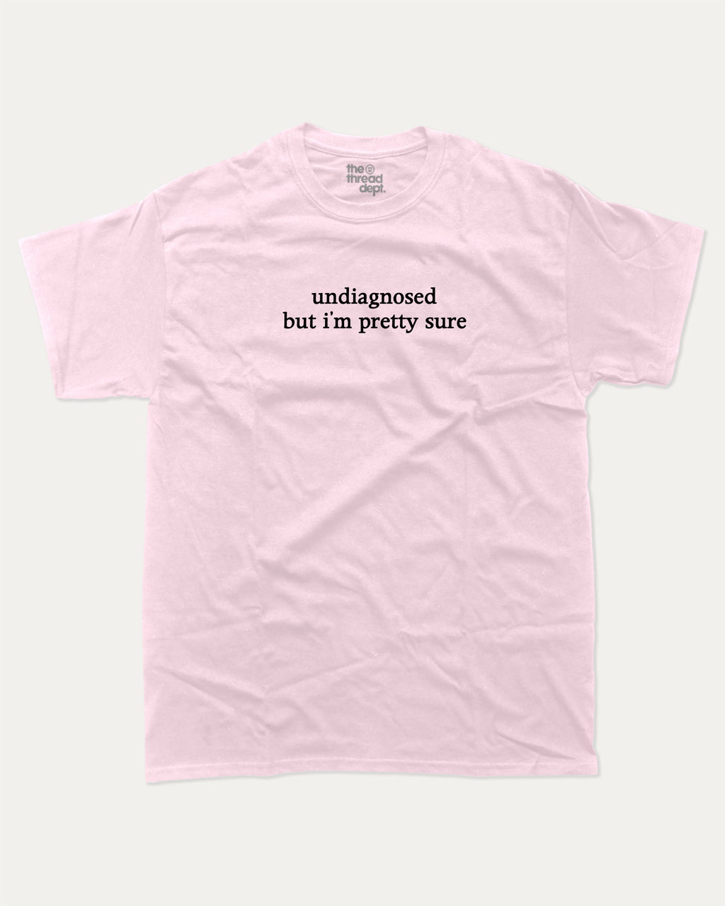Undiagnosed But I'm Pretty Sure graphic t-shirt, perfect for adults. Funny mental health tee, trending meme shirt, unique gift idea. Pink.
