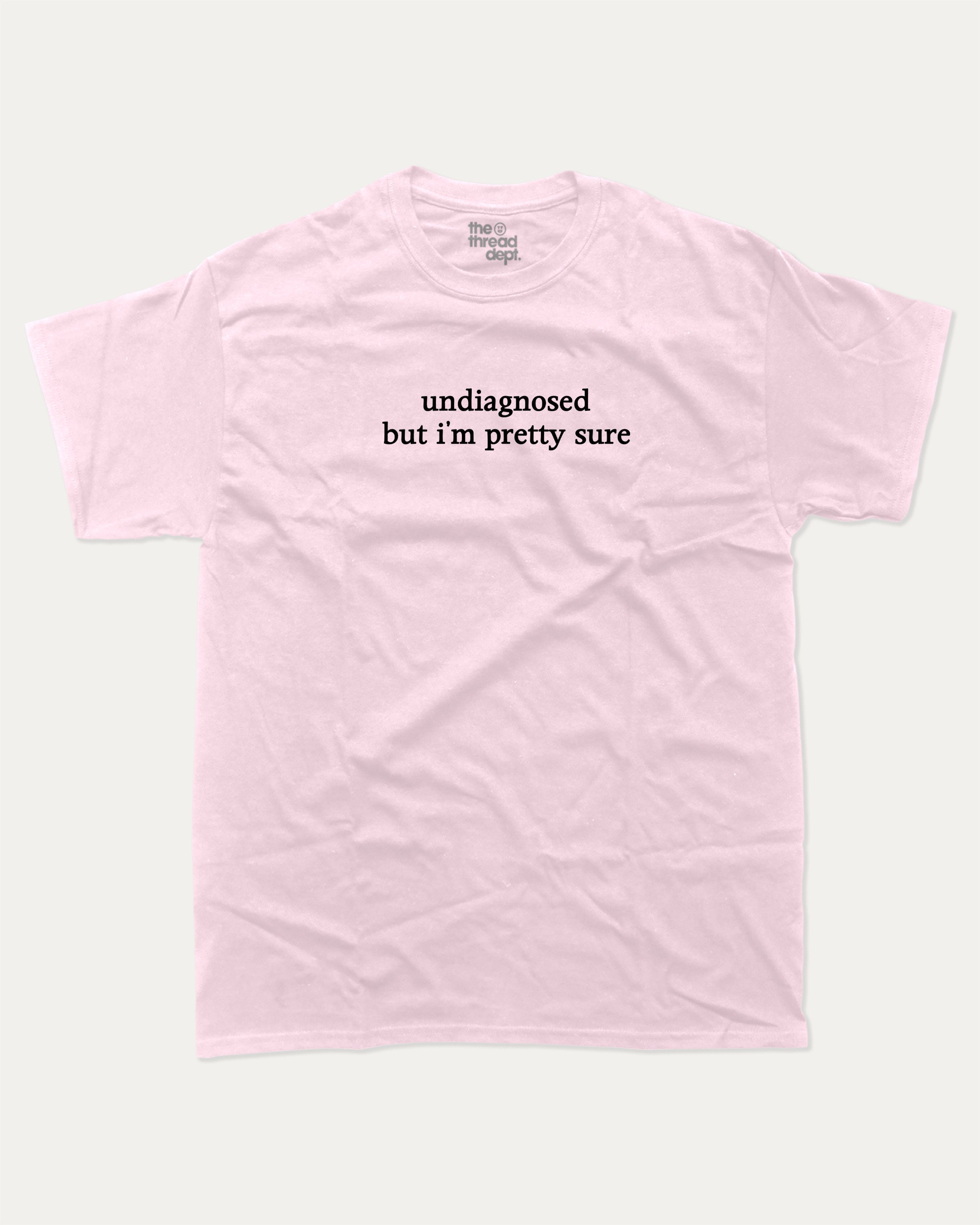 Undiagnosed But I'm Pretty Sure graphic t-shirt, perfect for adults. Funny mental health tee, trending meme shirt, unique gift idea. Pink.