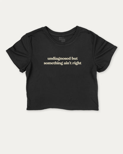 Undiagnosed But Something Ain't Right cute and trendy crop tee with nostalgic graphic, perfect for women. A must-have cropped aesthetic shirt, ideal for daily outfits and casual days. Black crop tee