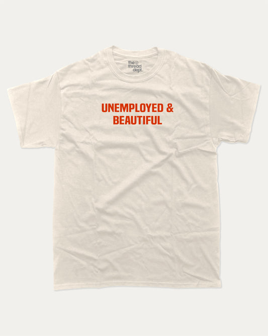 Unemployed and Beautiful graphic t-shirt, Pun Graphic T shirt, Funny Words T shirt, Humorous Graphic T shirt, A must-have funny tee, trending meme shirt, unique gift idea. Cream.