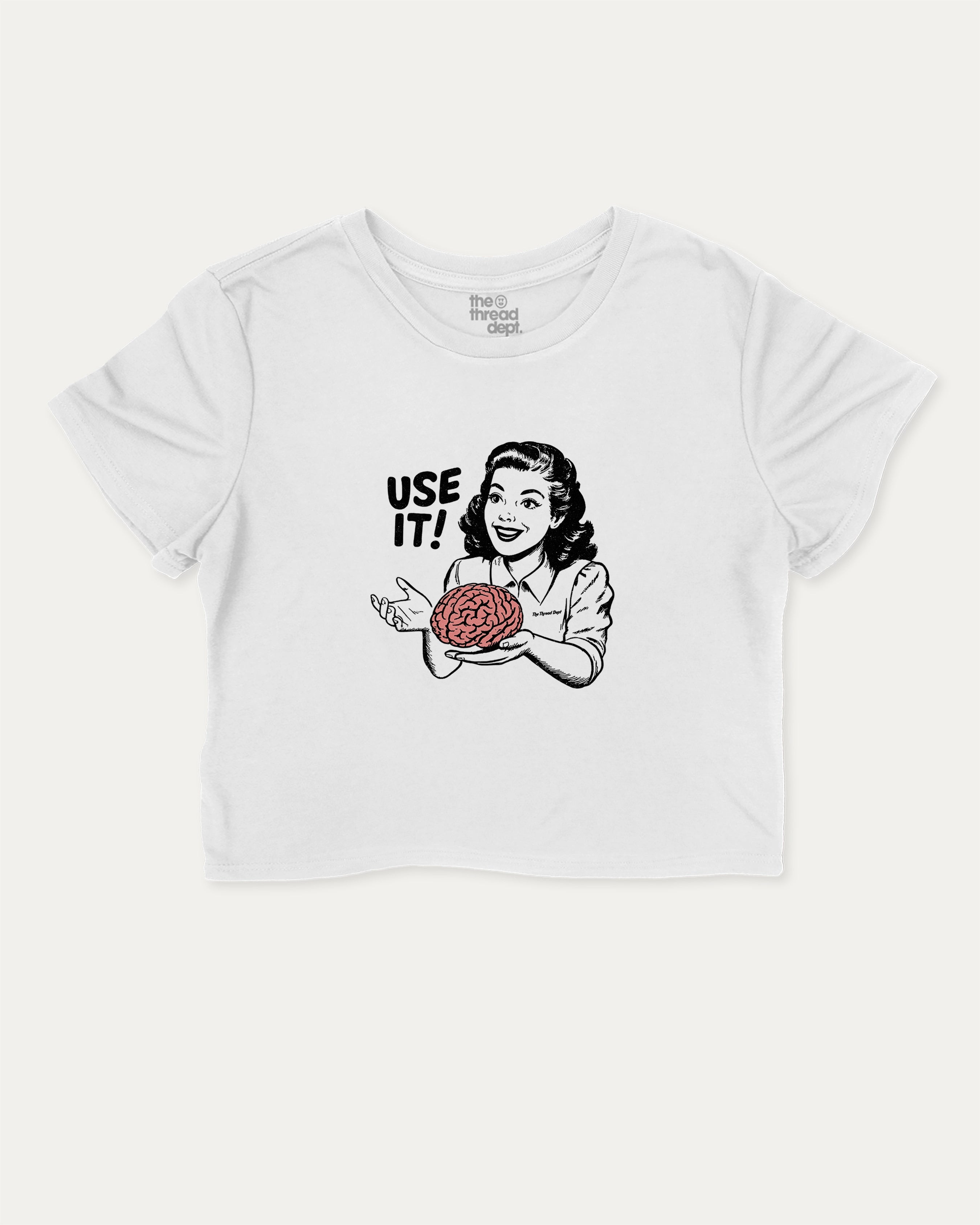 Use Your Brain graphic crop tee with funny and retro 70s slogan print, perfect for women’s casual looks or layering. White crop t-shirt.