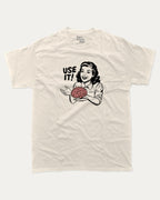 Use Your Brain graphic tee with retro 70s and humorous print, funny and trendy graphic. Perfect for adults and gift-giving. Cream shirt.