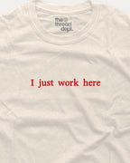 White t-shirt with red text 'I just work here' and 'the thread dept.' logo on a white background