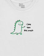 White t-shirt with a green dinosaur graphic and text 'i love you this much' on a white background.