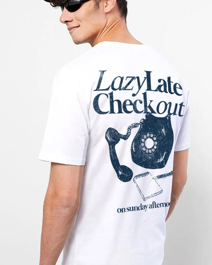 Person wearing a white t-shirt with a graphic design and text on a plain background