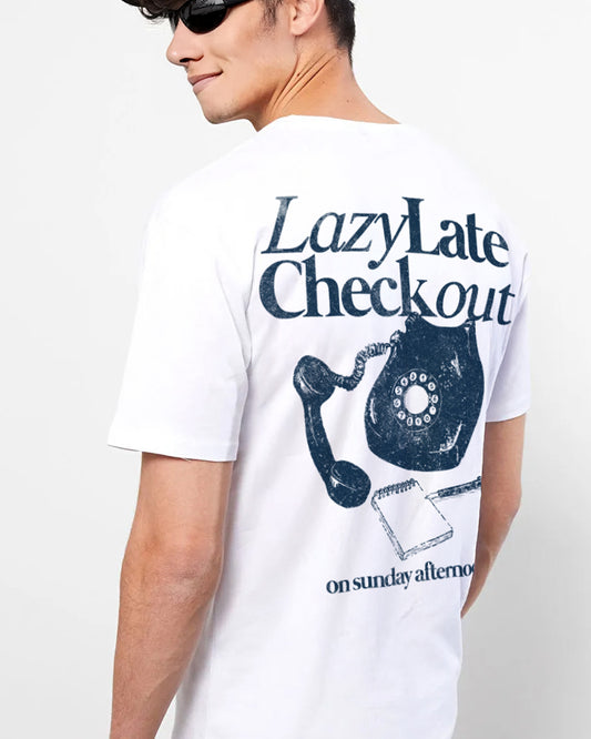 Person wearing a white t-shirt with a graphic design and text on a plain background