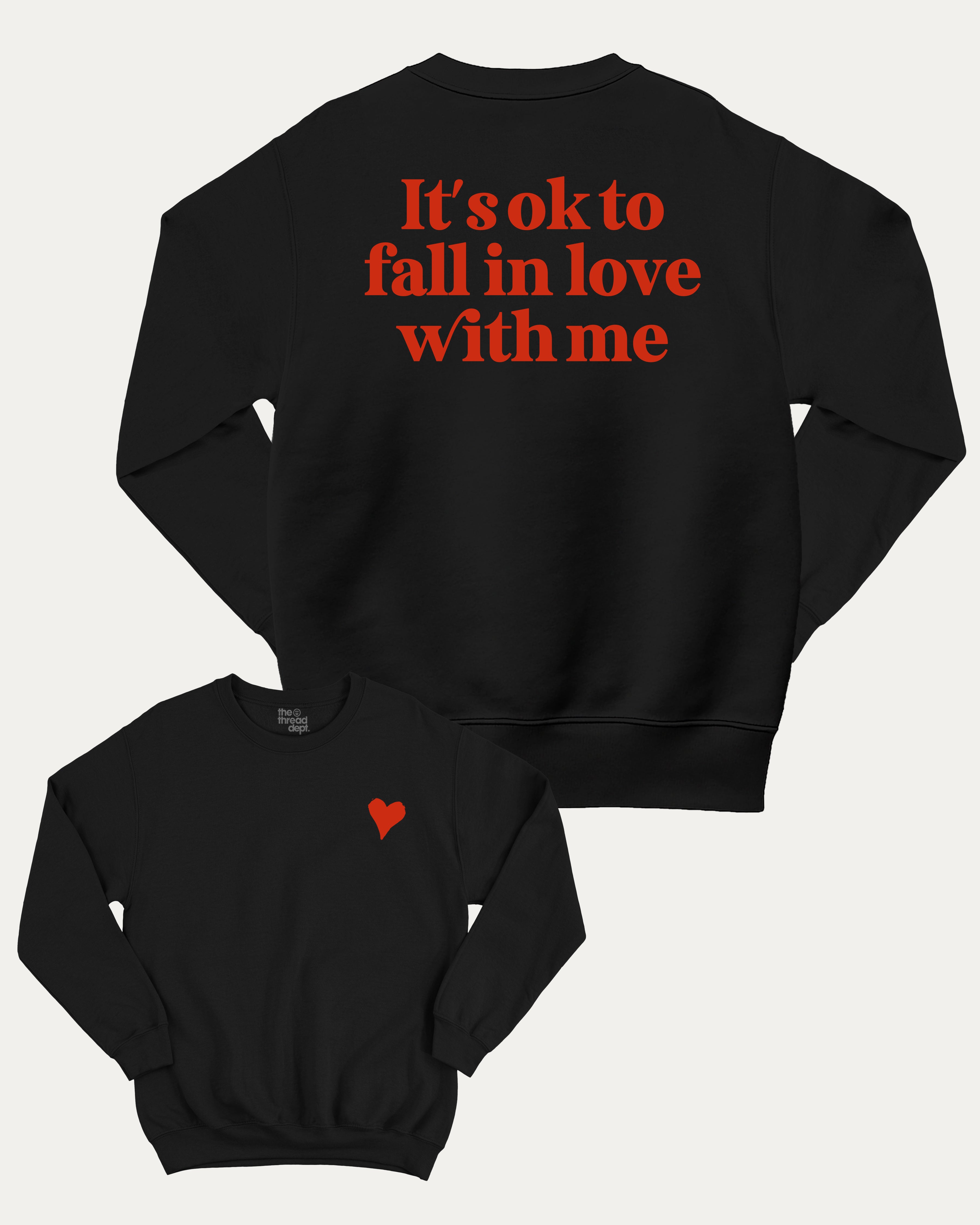 It's ok to fall in love with me graphic sweatshirt with bold and humorous print, Valentine Day Graphic T shirt, Perfect Gift for Valentine's Day, warm and cozy graphic for everyday wear. Perfect for adults and gift-giving. Black pullover.