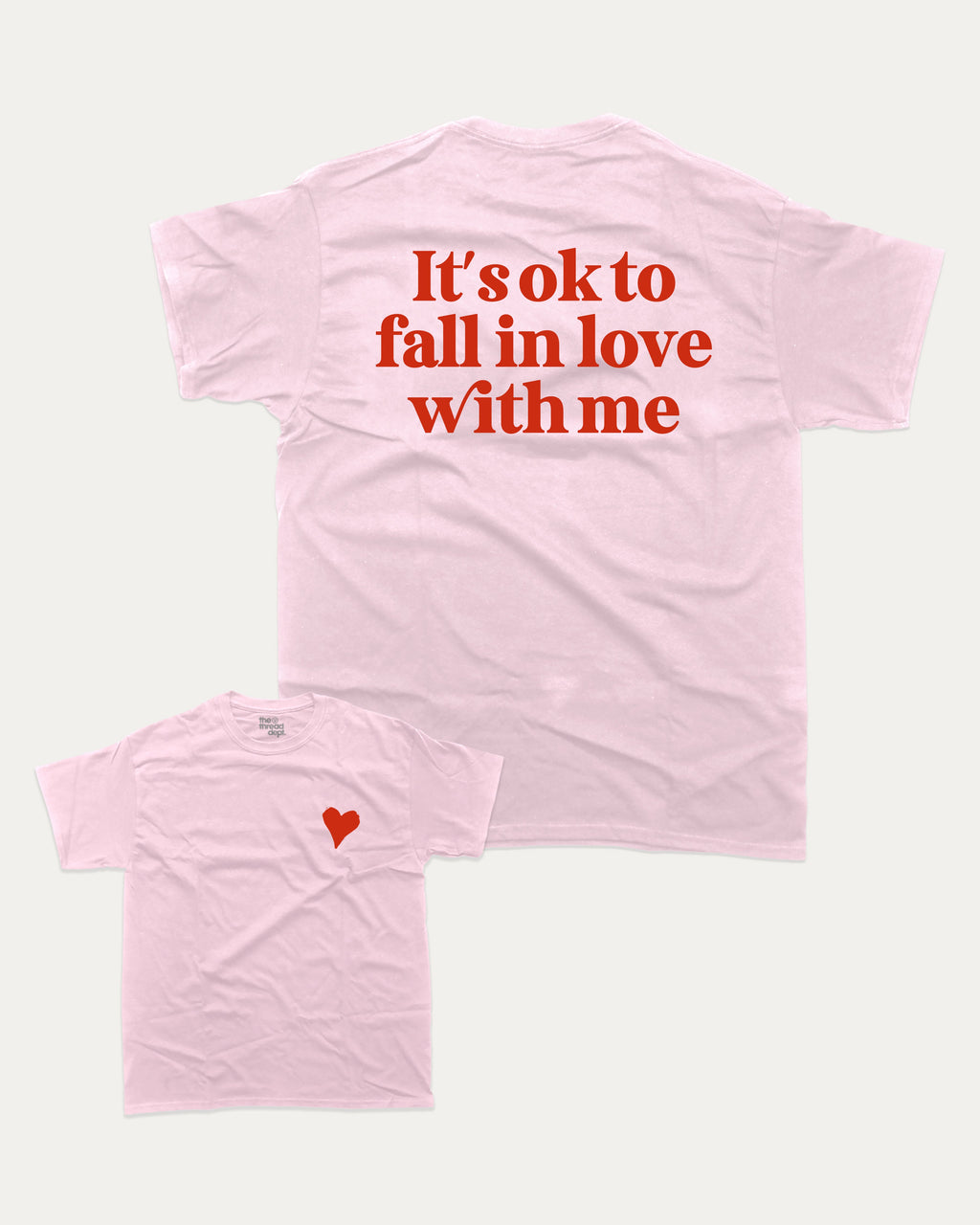 It's ok to fall in love with me graphic tee with bold and humorous print, Valentine Day Graphic T shirt, Perfect Gift for Valentine's Day, funny and trendy graphic. Perfect for adults and gift-giving. Pink shirt.