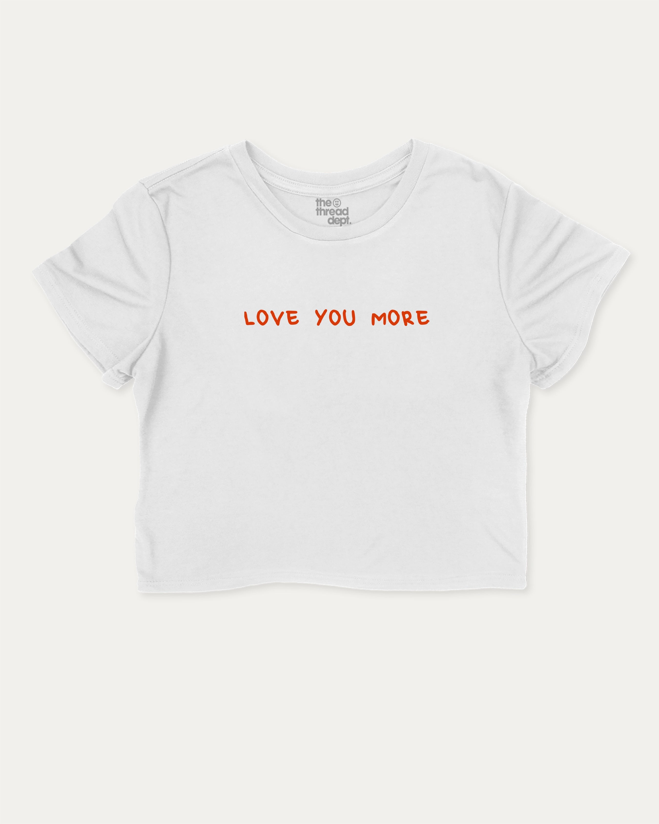 Love You More graphic crop tee with funny and trendy slogan print, perfect for women’s casual looks or layering. White crop t-shirt.