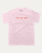 Love You More graphic tee with funny valentine print, trendy love graphic. Perfect for Valentine's Day gift-giving. Pink shirt.