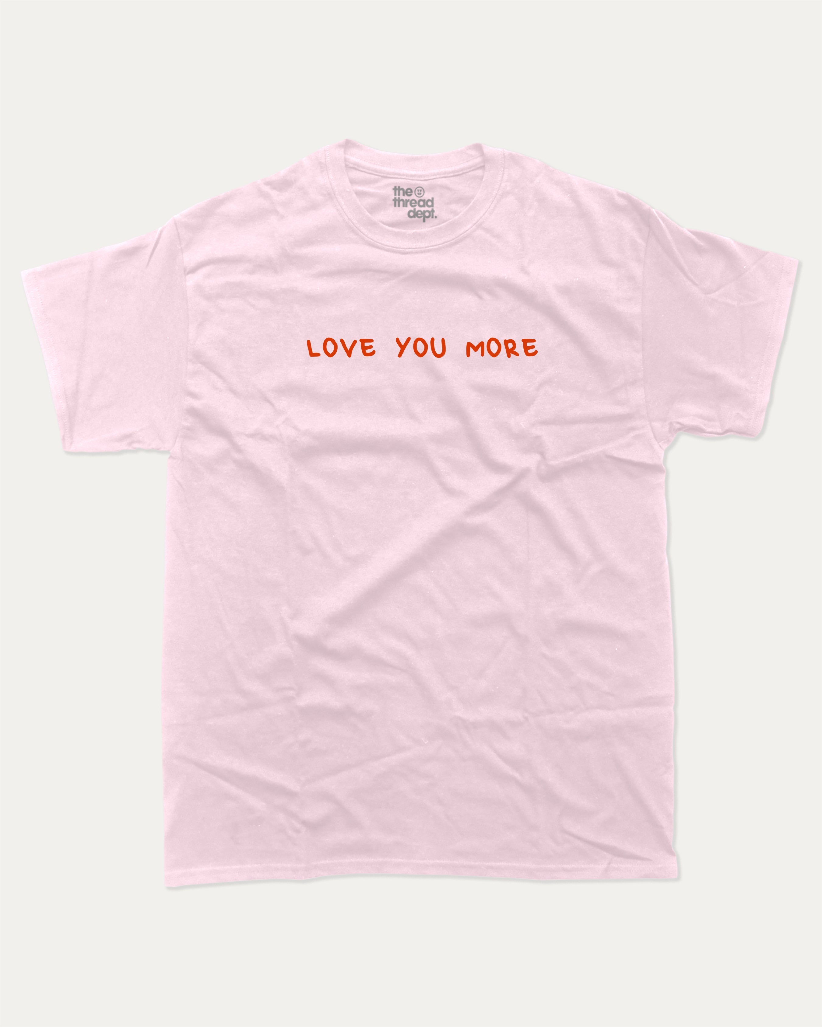 Love You More graphic tee with funny valentine print, trendy love graphic. Perfect for Valentine's Day gift-giving. Pink shirt.