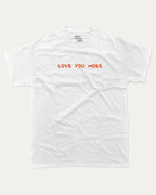 Love You More graphic tee with funny valentine print, trendy love graphic. Perfect for Valentine's Day gift-giving. White shirt.