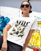 Person wearing a white t-shirt with ferret illustrations and "man, i love fettets" text, sitting in front of a colorful mural.