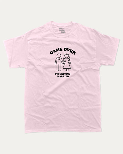 Game Over I'm Getting Married graphic t-shirt, perfect for adults. A must-have funny marriage tee, trending meme shirt, unique gift idea. Pink.
