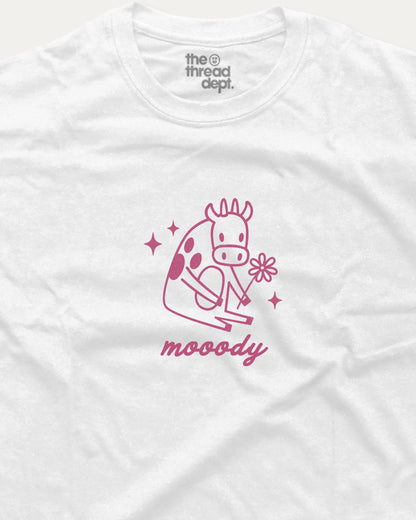 White t-shirt with pink giraffe graphic and 'moody' text on a white background