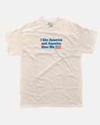 I like America and America likes me graphic tee with bold and humorous print, Perfect Gift for Patriotic People, funny and trendy graphic. Perfect for adults and gift-giving. Cream shirt.