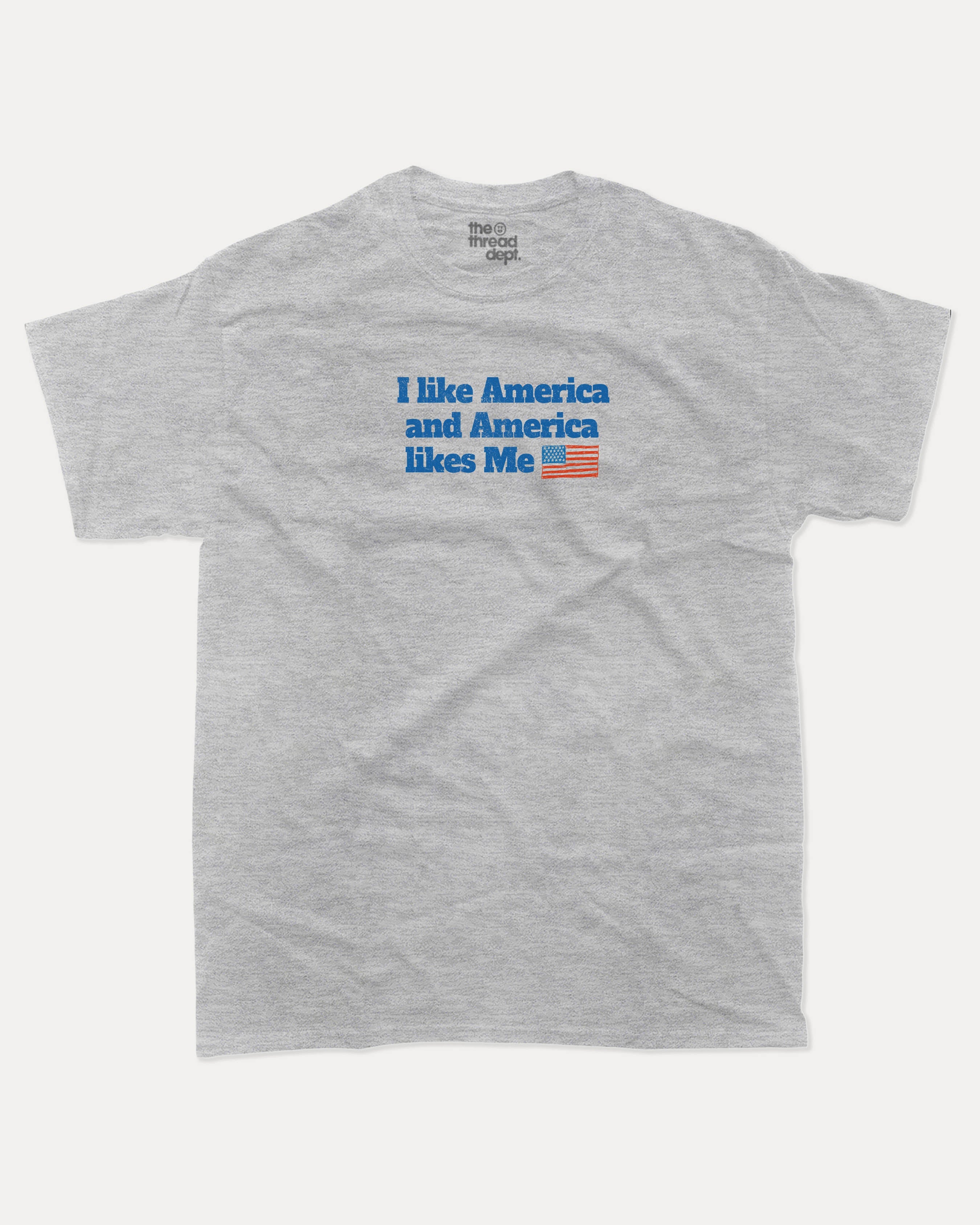 I like America and America likes me graphic tee with bold and humorous print, Perfect Gift for Patriotic People, funny and trendy graphic. Perfect for adults and gift-giving. Heather Grey shirt.