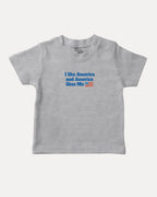 I like America and America likes me graphic tee with bold and humorous print, Perfect Gift for Patriotic People, funny and trendy graphic. Perfect for adults and gift-giving. Heather Grey shirt.