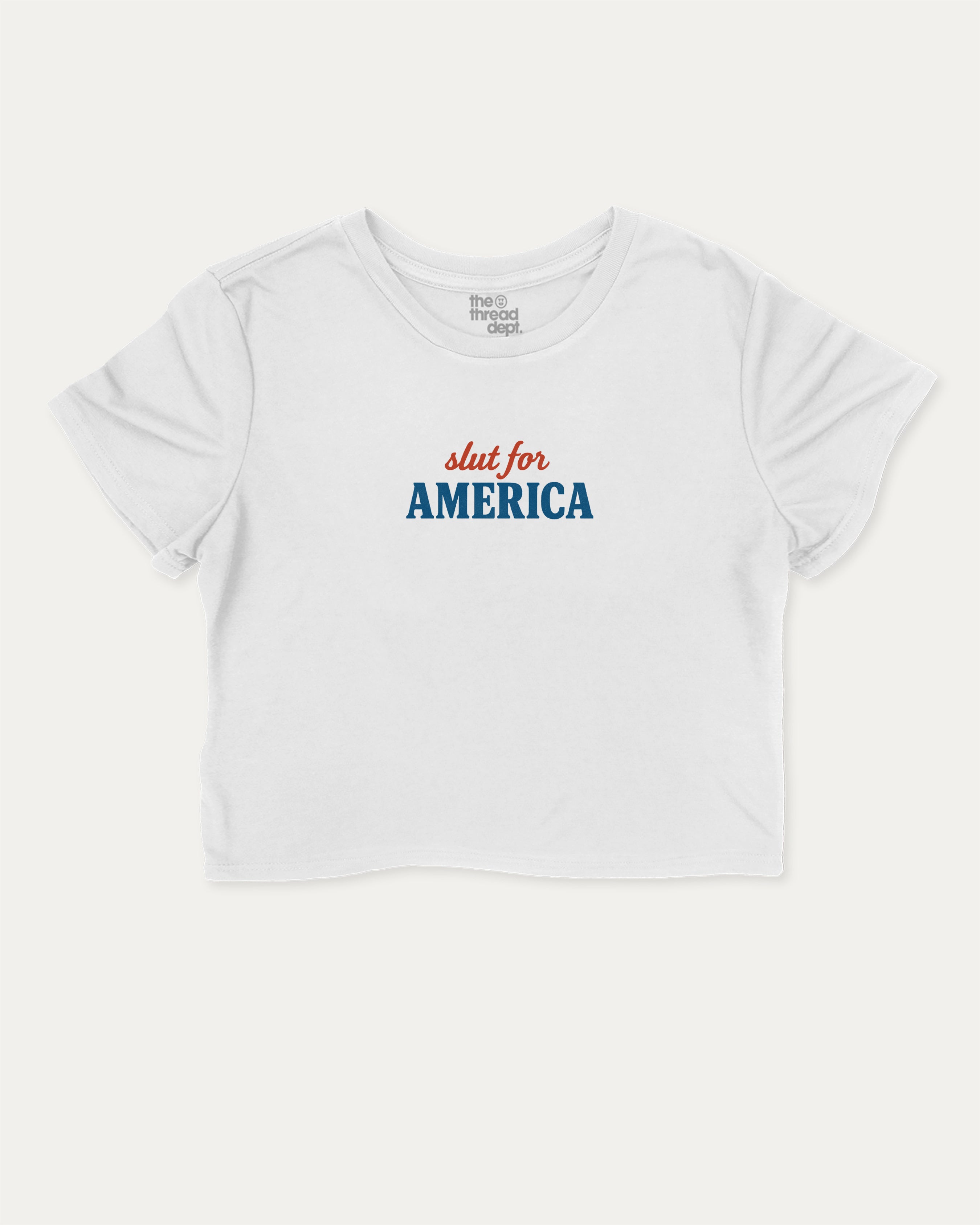 Slut For America graphic crop tee with funny and trendy slogan print, perfect for women_ casual looks or layering. White crop t-shirt.