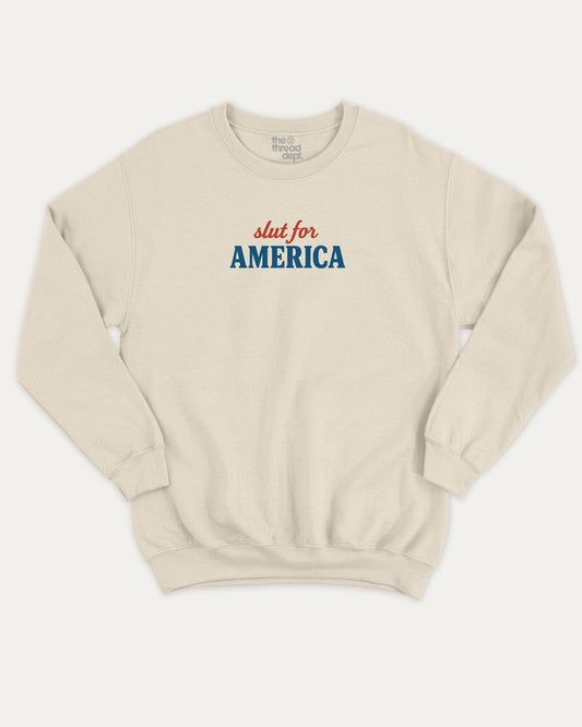 Slut For America graphic sweatshirt with bold and humorous print, warm and cozy graphic for everyday wear. Perfect for adults and gift-giving. Natural pullover.