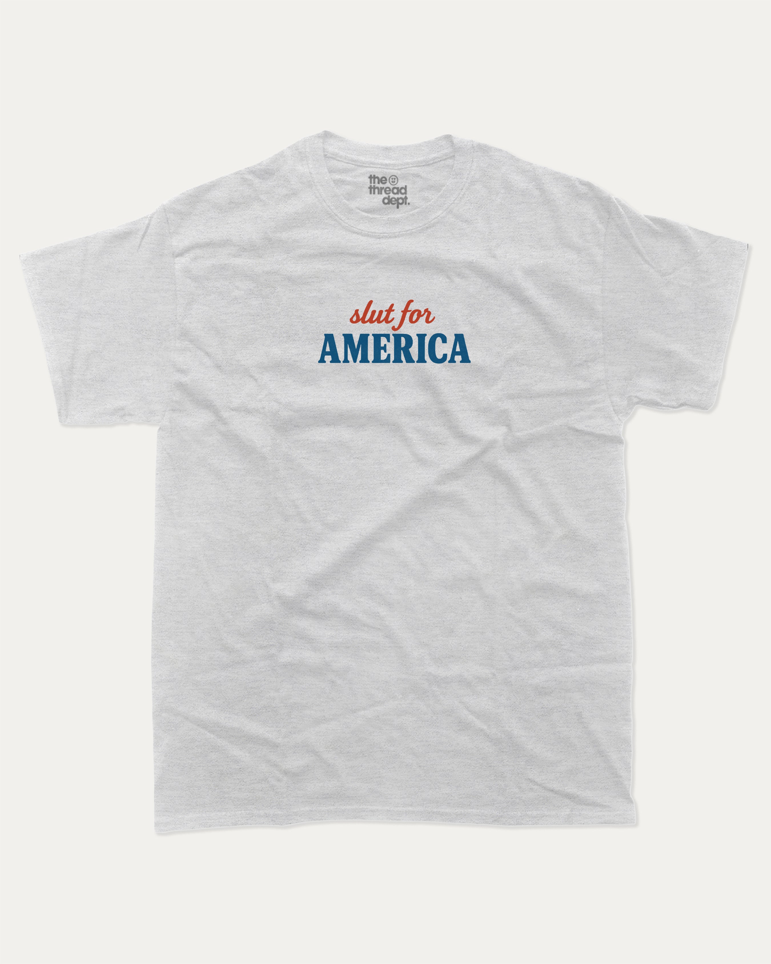 Slut For America graphic tee with bold and humorous print, funny america graphic. Perfect for adults and gift-giving. Ash Grey shirt.