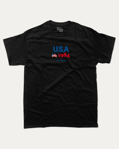 USA 1984 graphic t-shirt, perfect for adults. making it an ideal gift for national holidays like the 4th of July or for individuals who take pride in their country's heritage. Black.