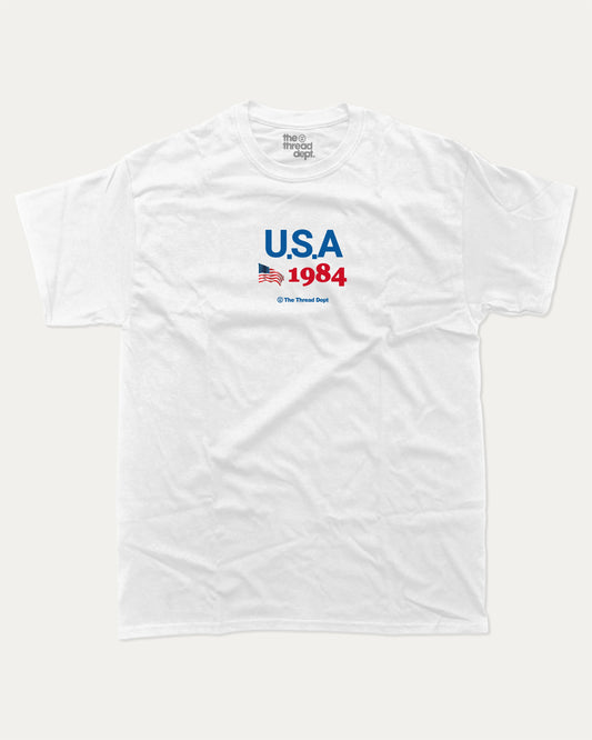 USA 1984 graphic t-shirt, perfect for adults. making it an ideal gift for national holidays like the 4th of July or for individuals who take pride in their country's heritage. White.