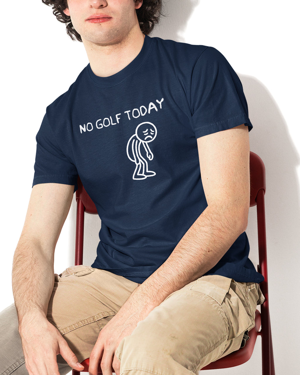 Person wearing a navy blue t-shirt with 'No Golf Today' text and graphic.