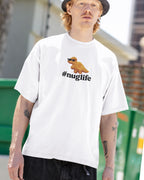 Person wearing a white t-shirt with a #Nuglife graphic and text, standing outdoors.