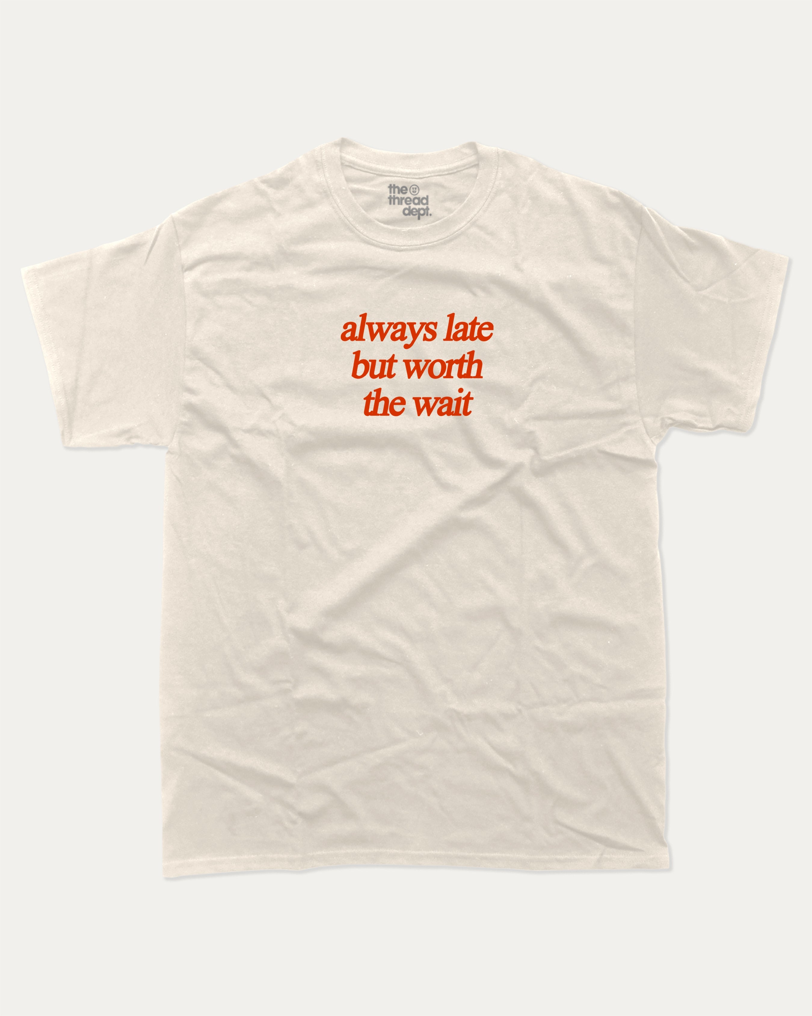always late but worth the wait graphic tee with bold and humorous print, funny and trendy graphic. Perfect for adults and gift-giving. Cream shirt.