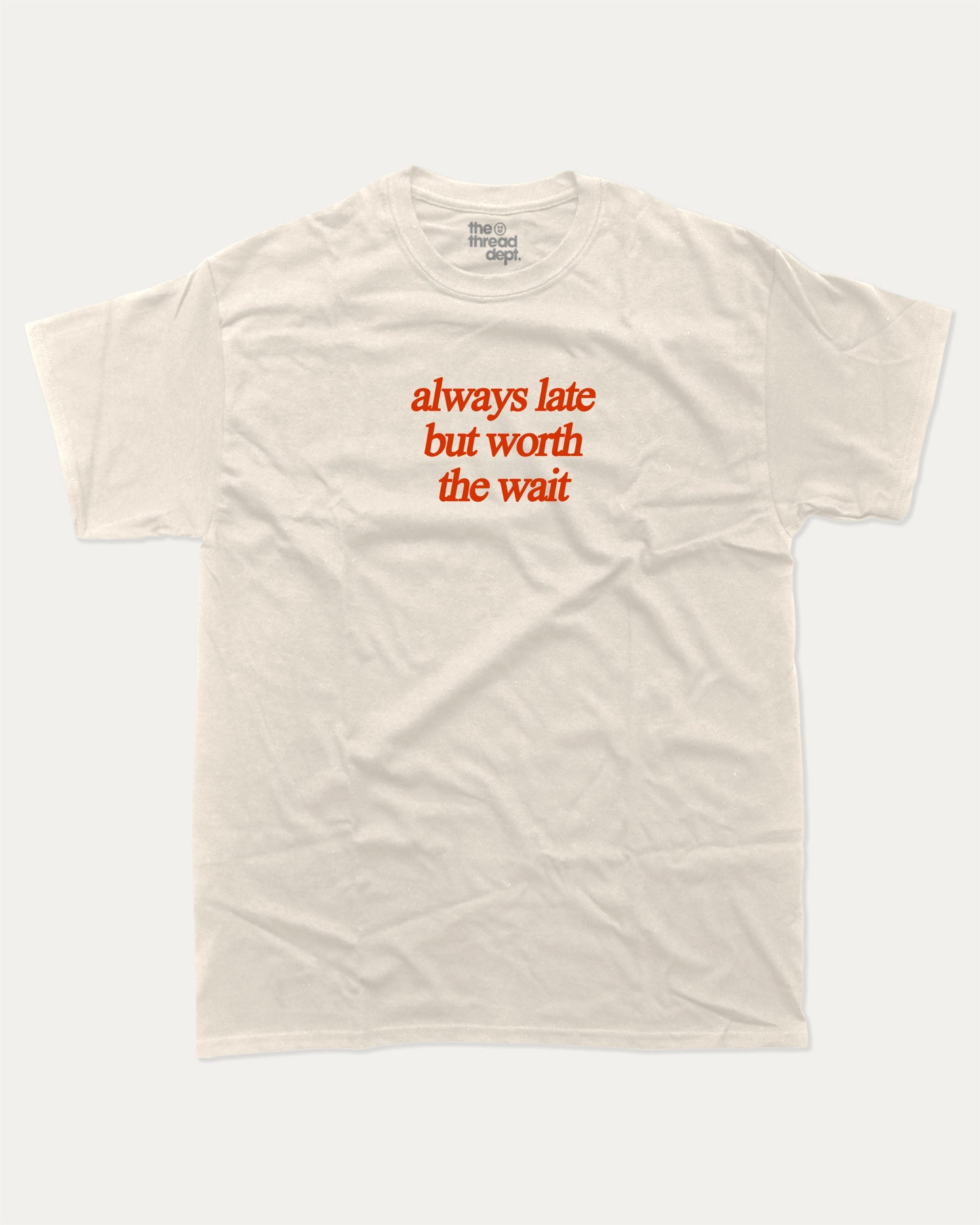 always late but worth the wait graphic tee with bold and humorous print, funny and trendy graphic. Perfect for adults and gift-giving. Cream shirt.