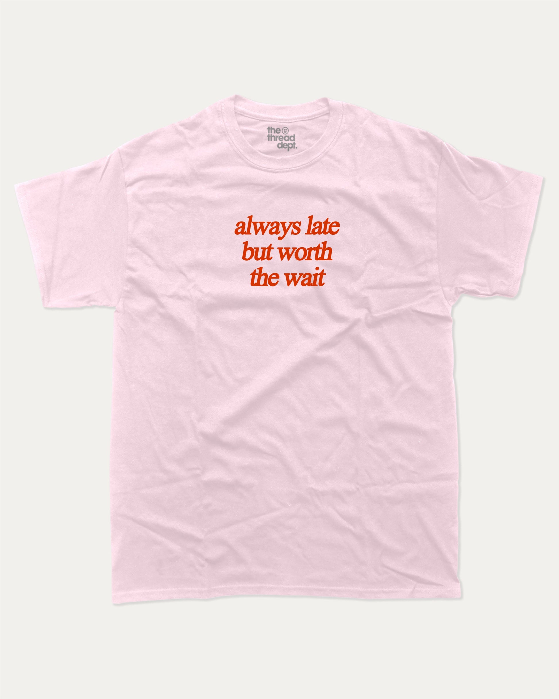 always late but worth the wait graphic tee with bold and humorous print, funny and trendy graphic. Perfect for adults and gift-giving. Pink shirt.