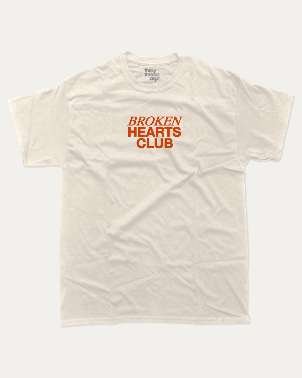Broken Hearts Club graphic tee with bold and humorous print, funny and trendy graphic. Vintage Inspired Graphic t shirt, Retro Inspired Graphic T shirt,  Perfect for adults and gift-giving. Cream shirt.