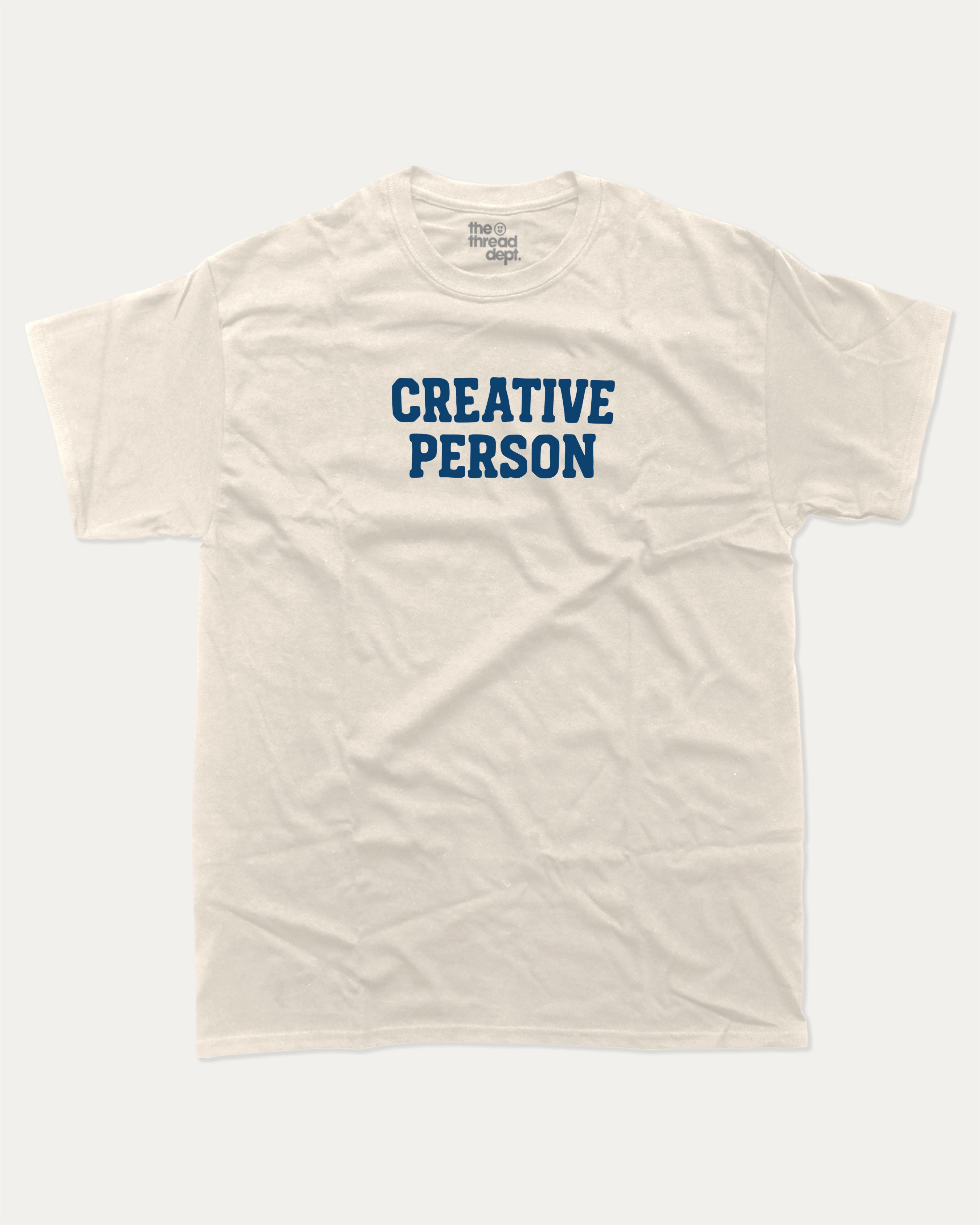 Creative Person graphic tee with bold and humorous print, funny and trendy graphic. Perfect for adults and gift-giving. Cream shirt.