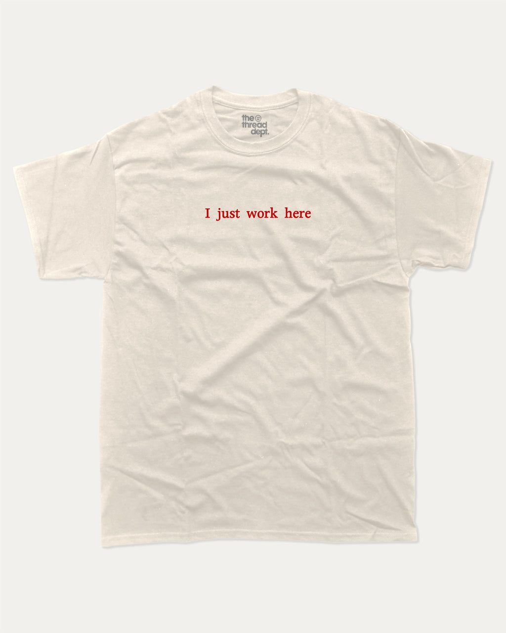 I Just Work Here graphic tee with bold and retro print, funny and trendy graphic. Perfect for adults and gift-giving. Cream shirt.