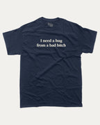 I Need A Hug From A Bad Bitch graphic tee with bold and funny print, funny and trendy graphic. Perfect for adults and gift-giving. True Navy shirt.