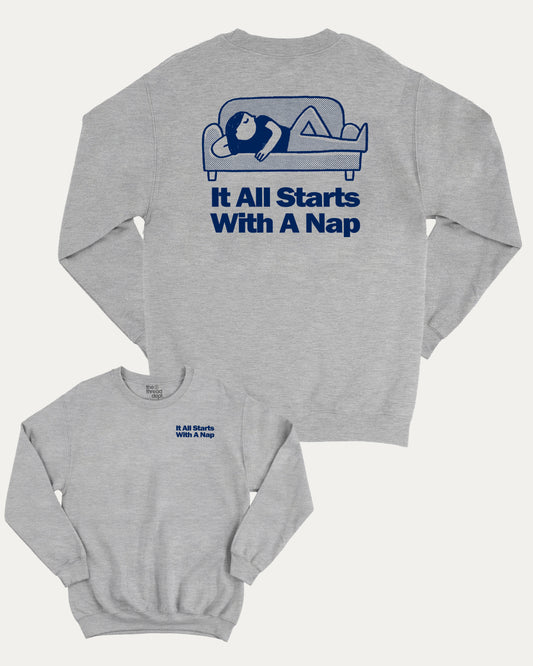 It All Starts With A Nap graphic sweatshirt with bold and humorous print, warm and cozy graphic for everyday wear. Perfect for adults and gift-giving. Heather Grey pullover.