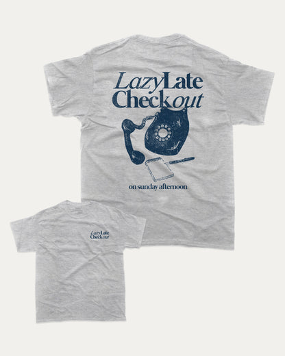 Lazy Late Check Out graphic tee with bold and humorous print, funny and trendy graphic. Retro Inspired Graphic T shirt, Vintage Inspired Graphic T shirt,  Perfect for adults and gift-giving. Heather Grey shirt.