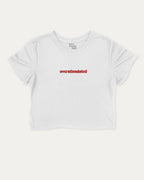 Overstimulated graphic crop tee with funny and trendy slogan print, perfect for women’s casual looks or layering. White crop t-shirt.
