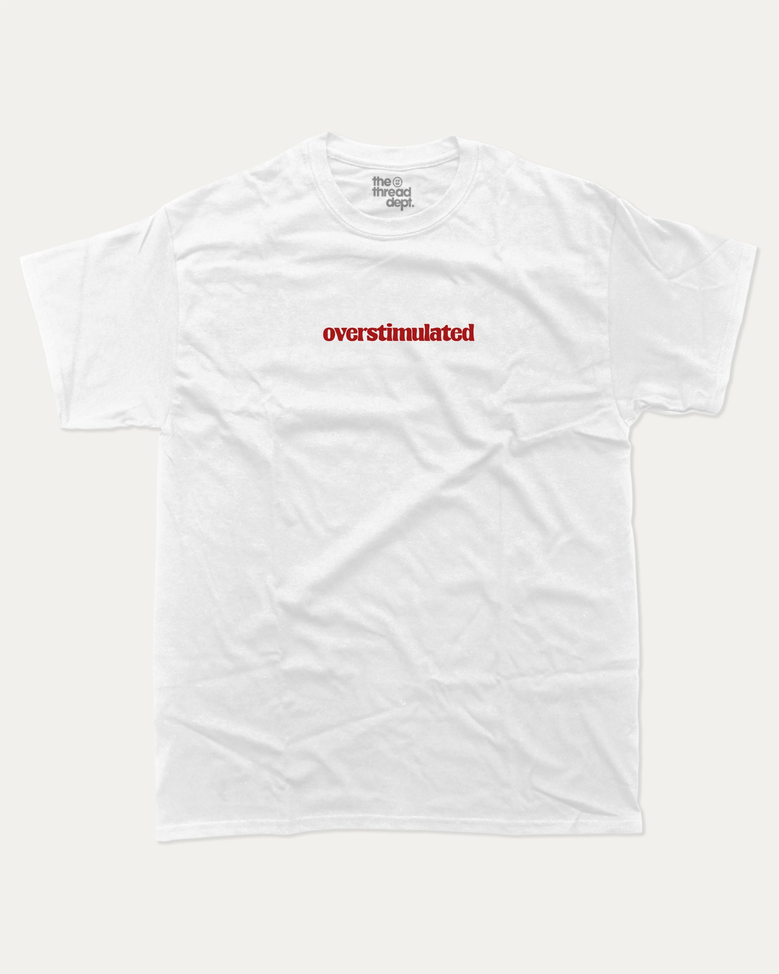 Overstimulated graphic t-shirt with bold and humorous print, funny and trendy graphic. Perfect funny gifts for friends. White shirt.