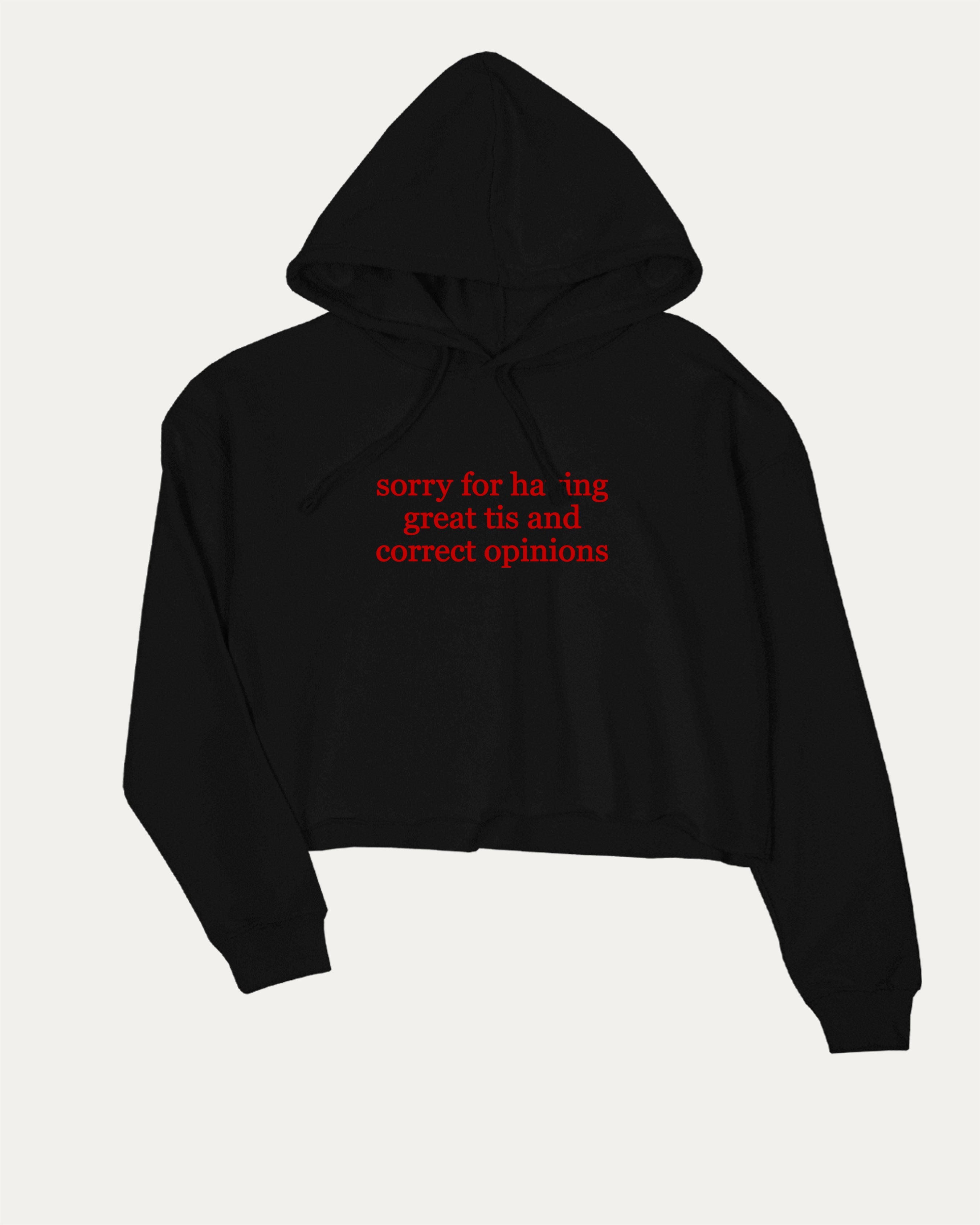 Sorry for Having Great Tits and Correct Opinions graphic crop hoodie with bold slogan print, stylish and playful design for women. Ideal for gifting and casual looks. Black crop top..