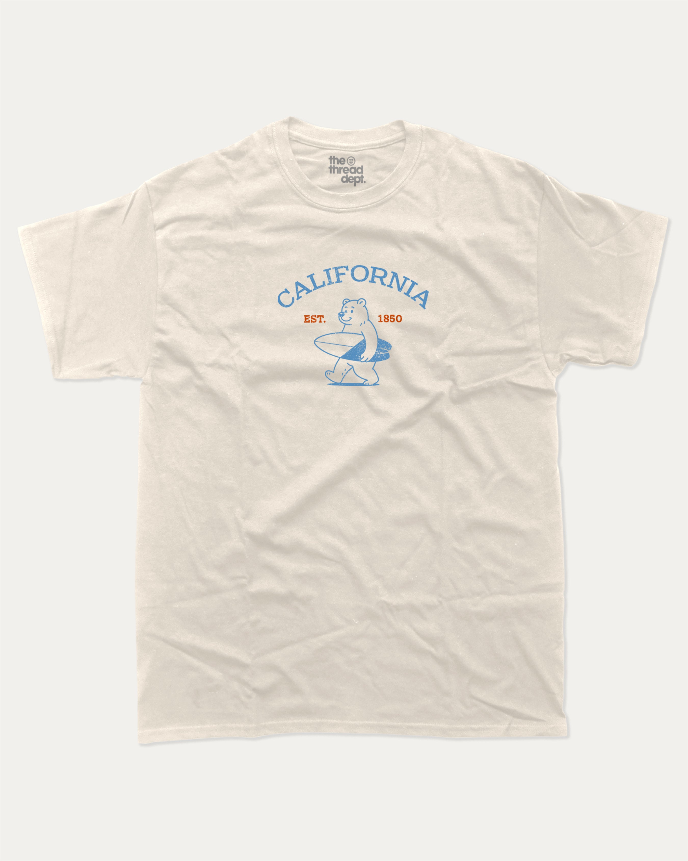 Surf in California graphic tee with bold and humorous print, Retro Inspired Graphic T shirt, Vintage Inspired Graphic T shirt, Perfect Gift for Surfers, State Graphic T shirt, California Graphic T shirt, funny and trendy graphic. Perfect for adults and gift-giving. Cream shirt.