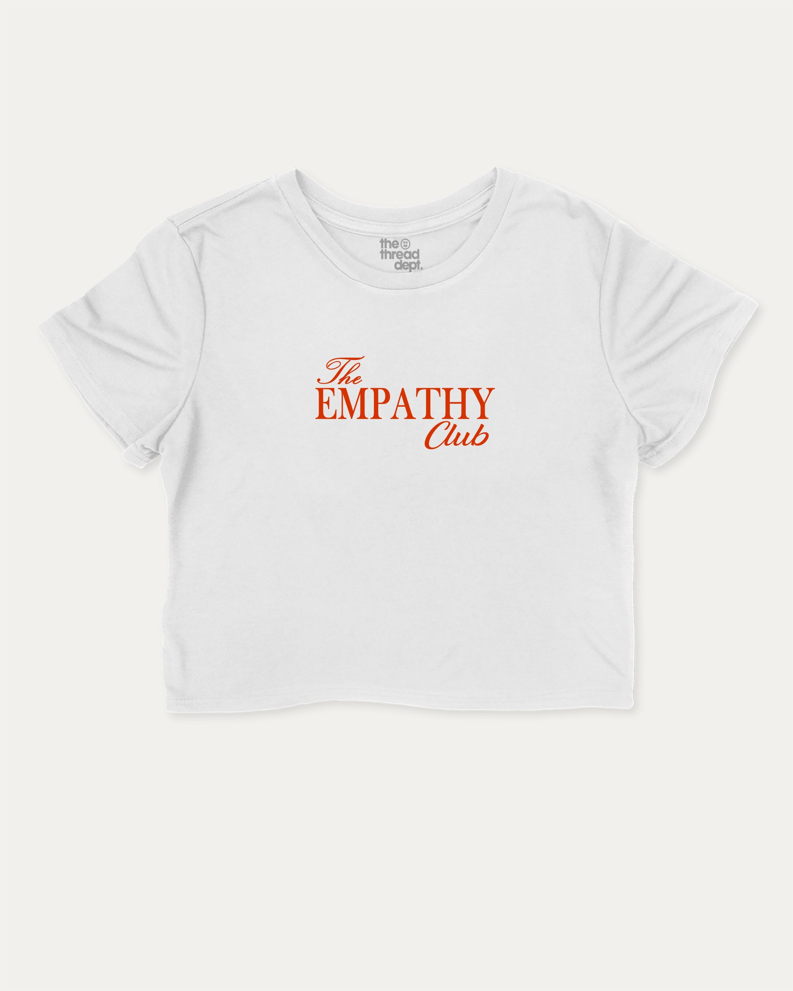 The Empathy Club graphic crop tee with funny and trendy slogan print, perfect for women’s casual looks or layering. White crop t-shirt.