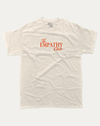 The Empathy Club graphic tee with bold and humorous print, funny and trendy graphic. Perfect for adults and gift-giving. Cream shirt.