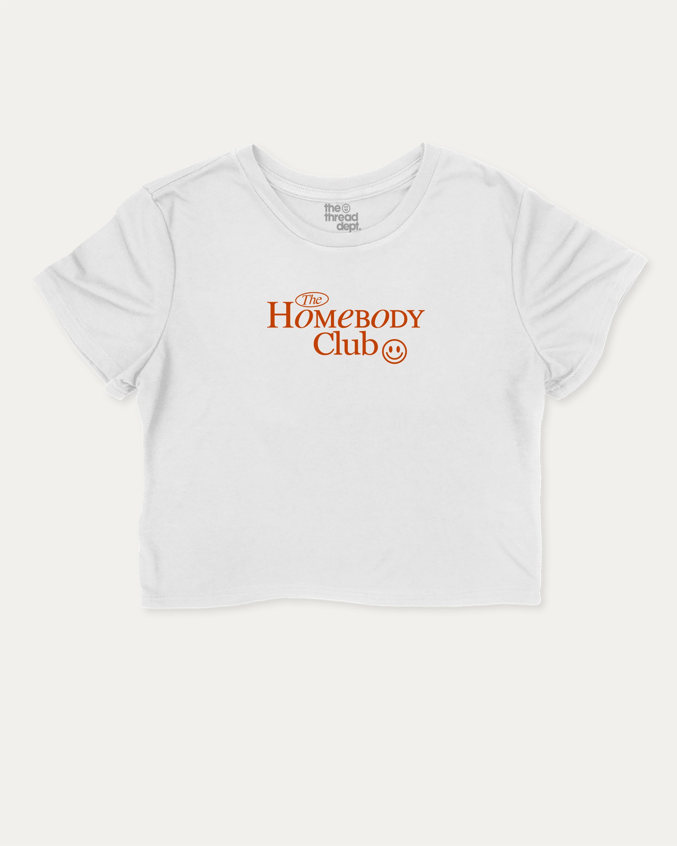 The Homebody Club graphic crop tee with funny and trendy slogan print, perfect for women_ casual looks or layering. White crop t-shirt.
