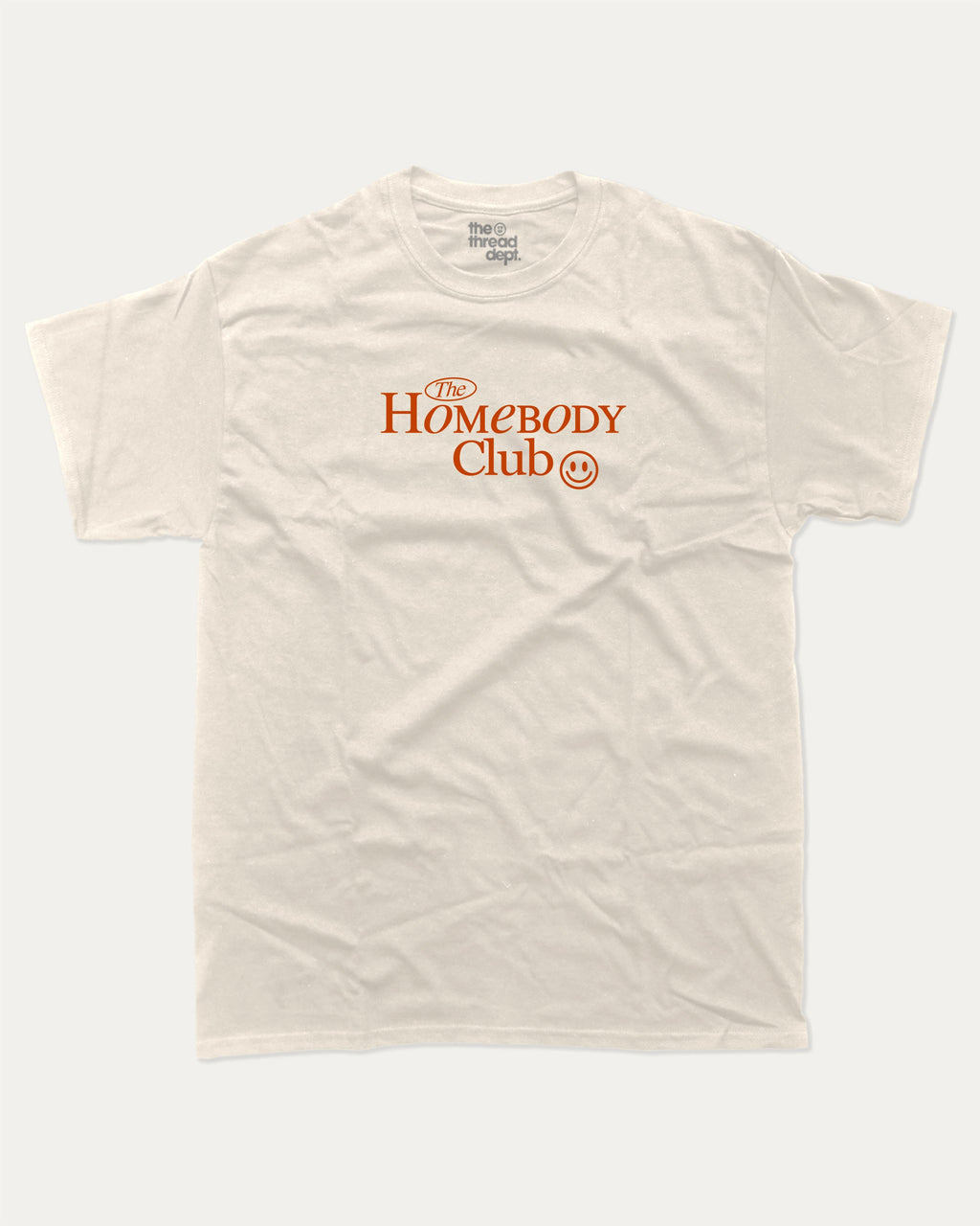 The Homebody Club graphic tee with bold and humorous print, funny and trendy graphic. Vintage Inspired Graphic t shirt, Retro Inspired Graphic T shirt,  Perfect for adults and gift-giving. Cream shirt.